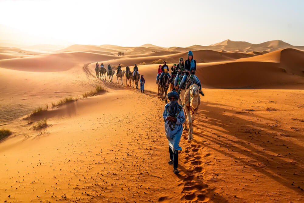 Traditional Moroccan dining experience at Hotel Les Roches Merzouga in the Sahara Desert.